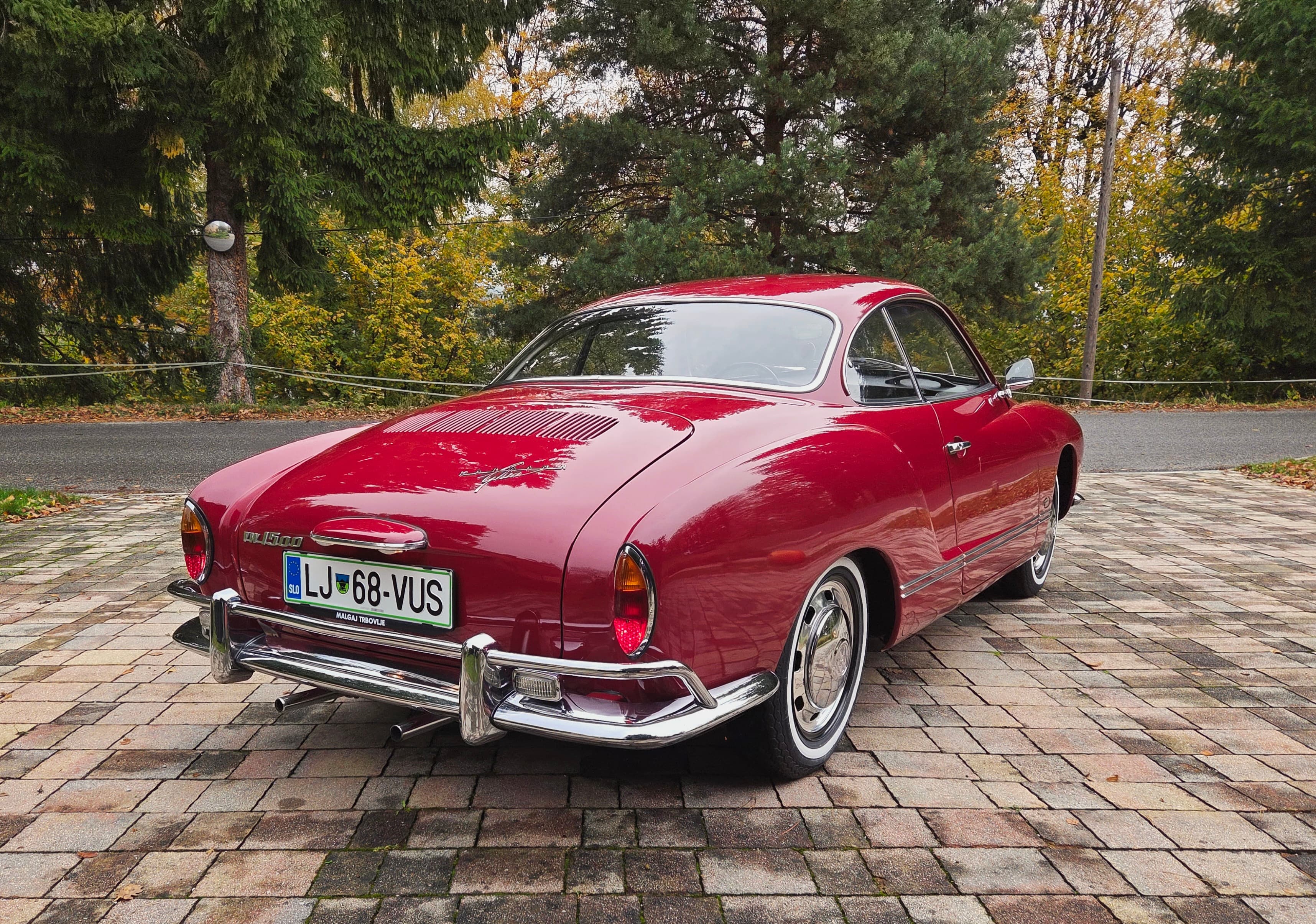 Stunning VW Karmann Ghia Coupe in cherry red with original equipment.