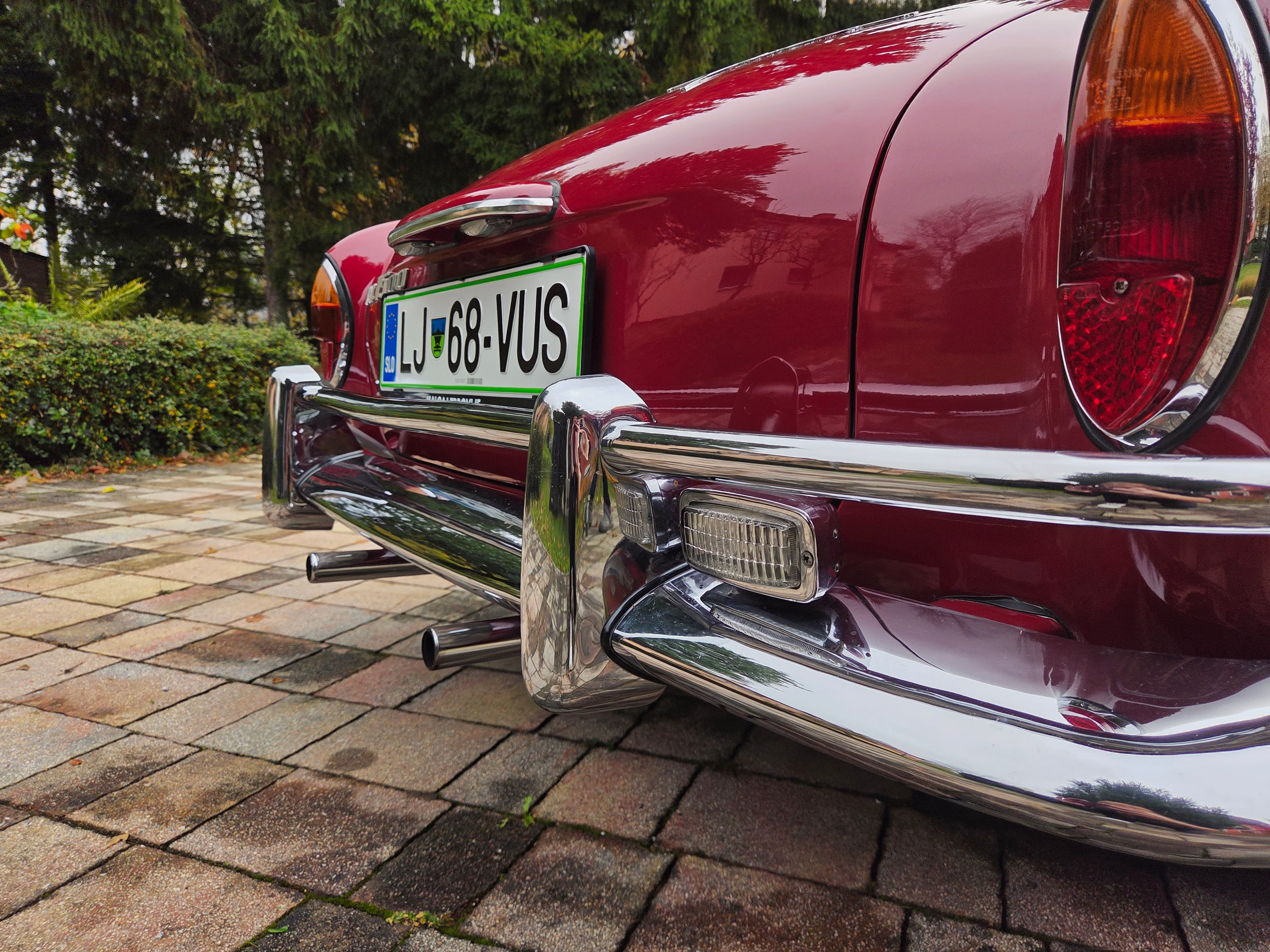 Stunning VW Karmann Ghia Coupe in cherry red with original equipment.