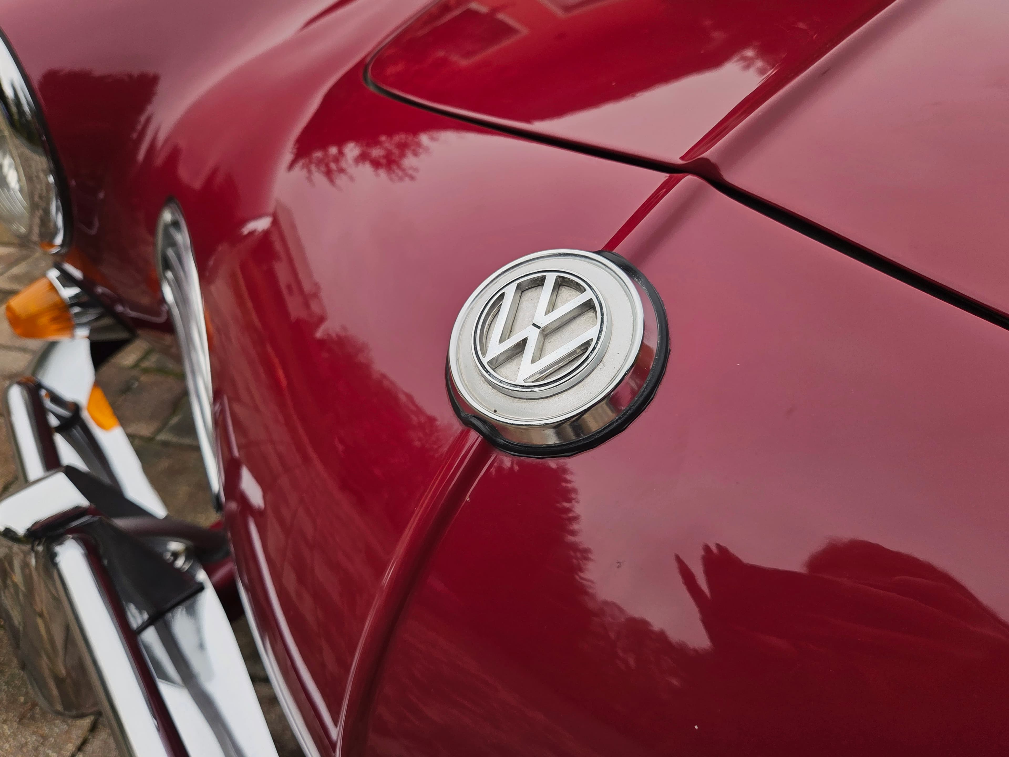 Stunning VW Karmann Ghia Coupe in cherry red with original equipment.