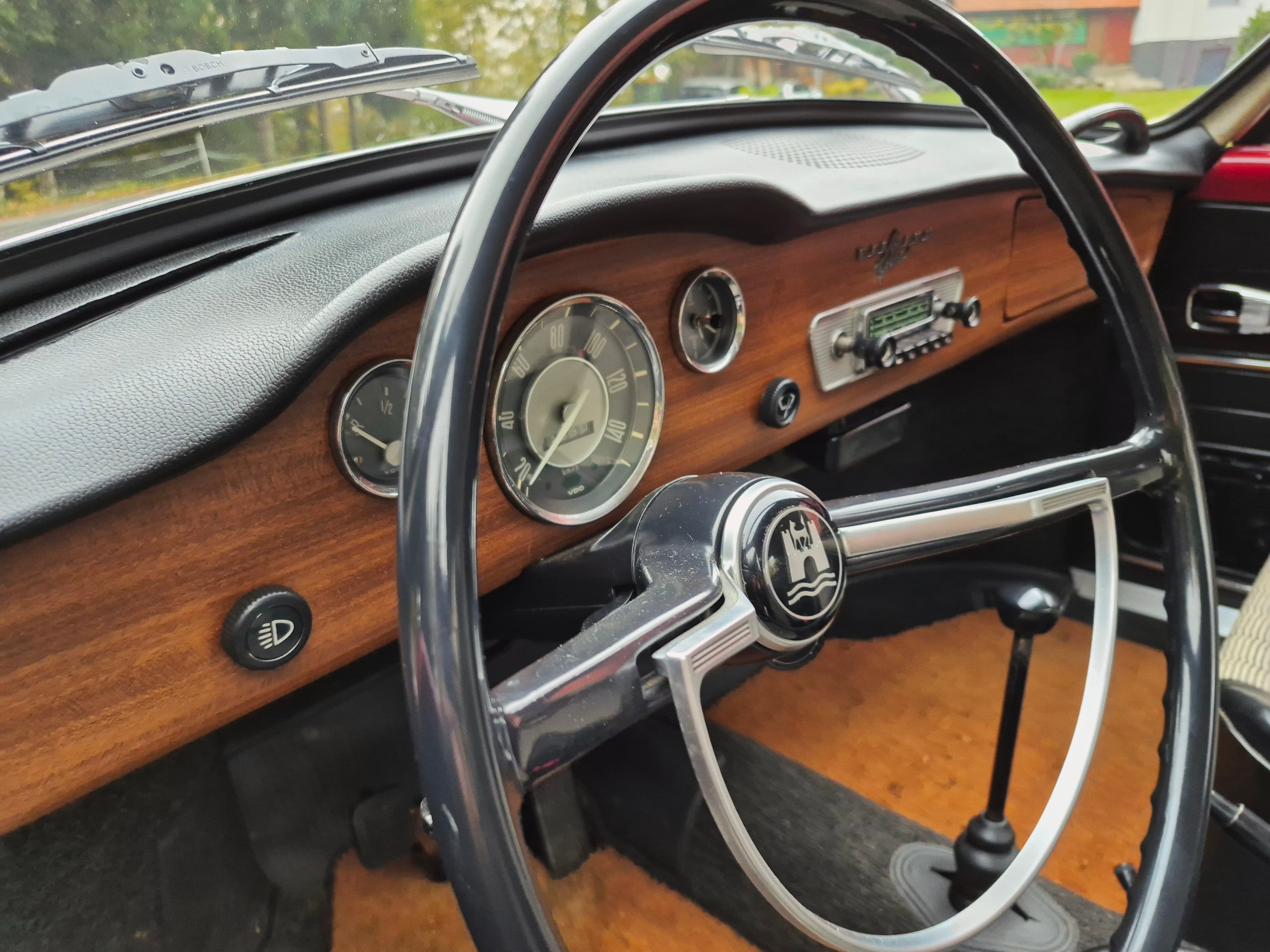Stunning VW Karmann Ghia Coupe in cherry red with original equipment.