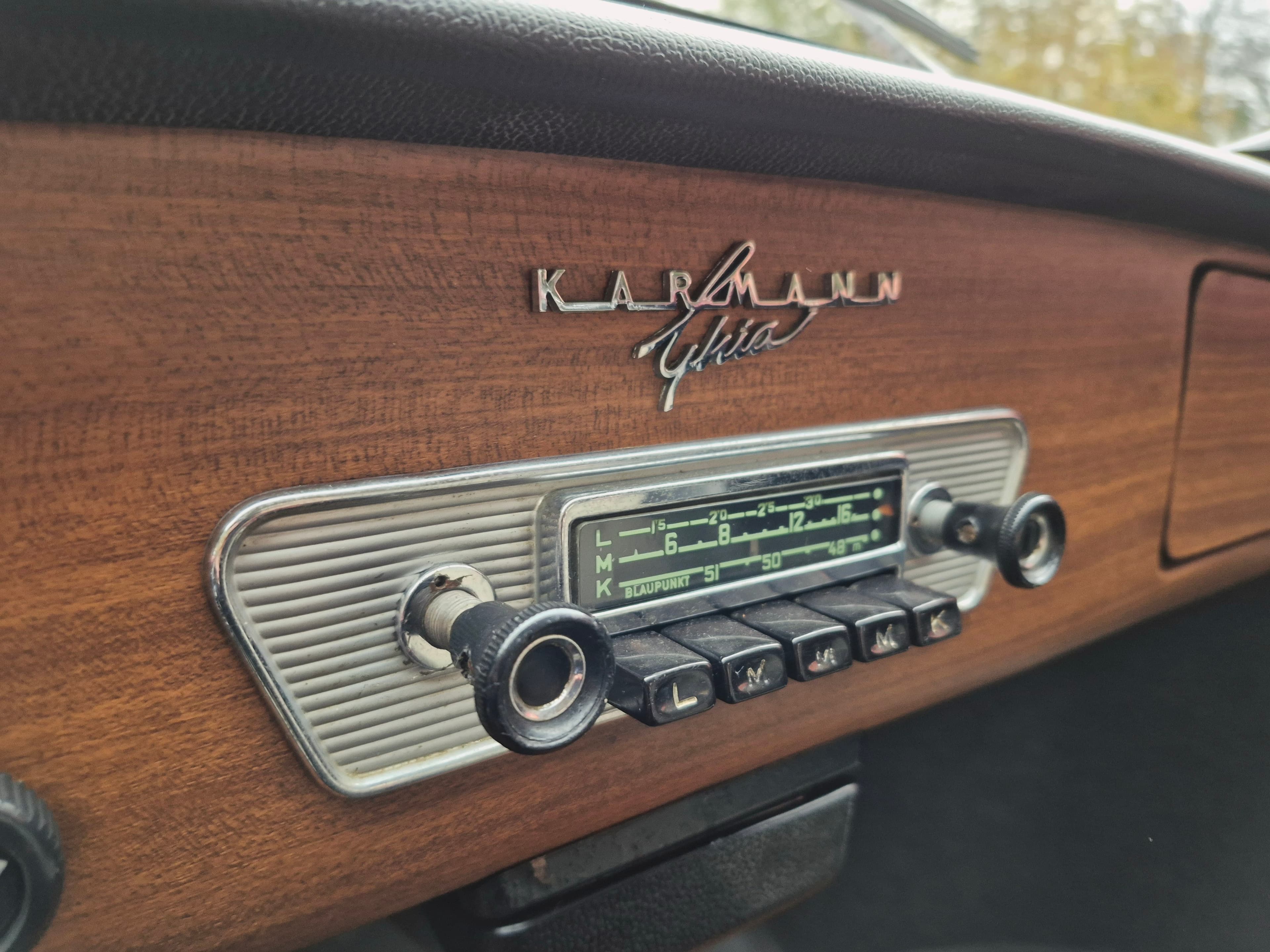 Stunning VW Karmann Ghia Coupe in cherry red with original equipment.