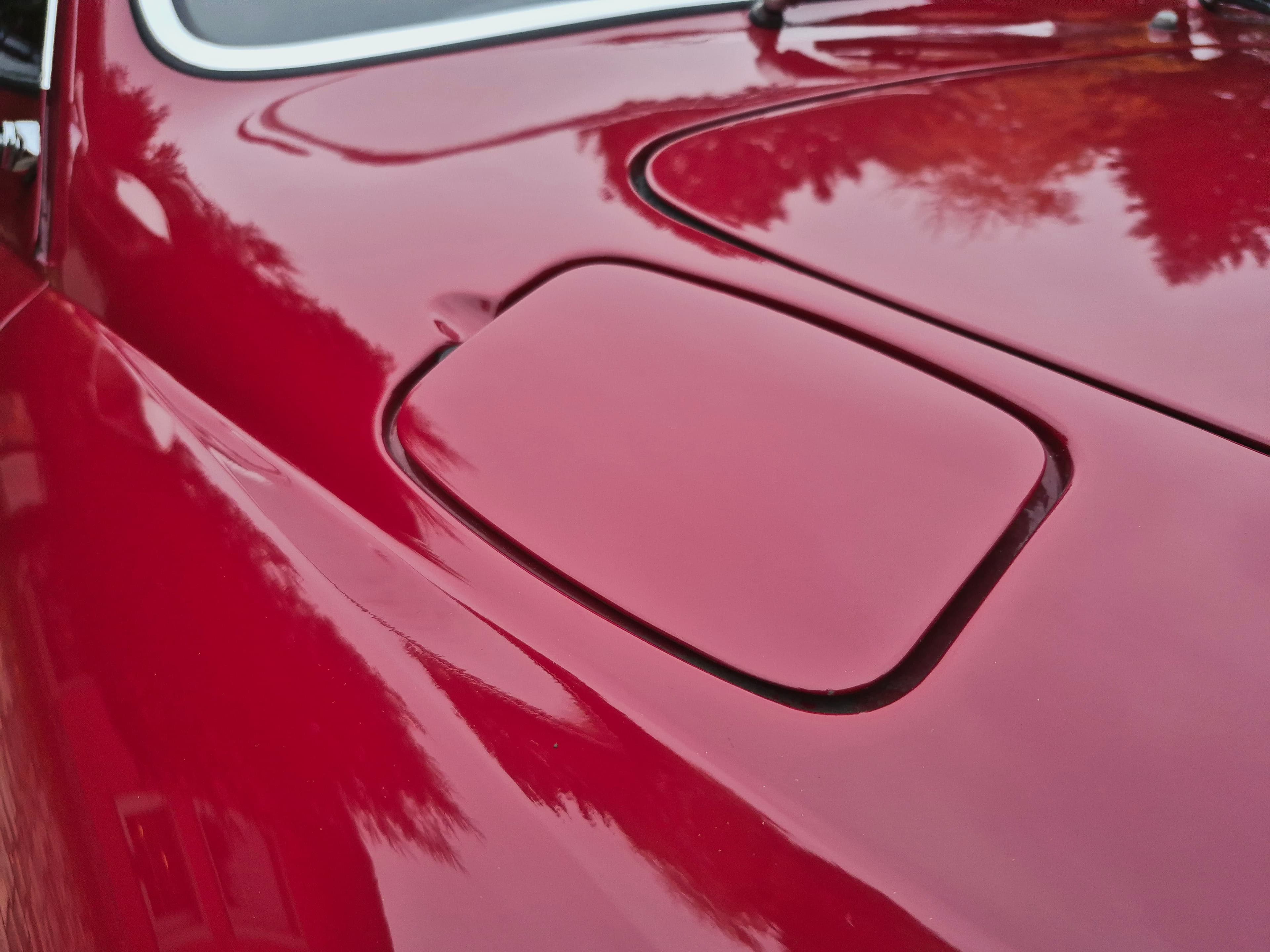 Stunning VW Karmann Ghia Coupe in cherry red with original equipment.