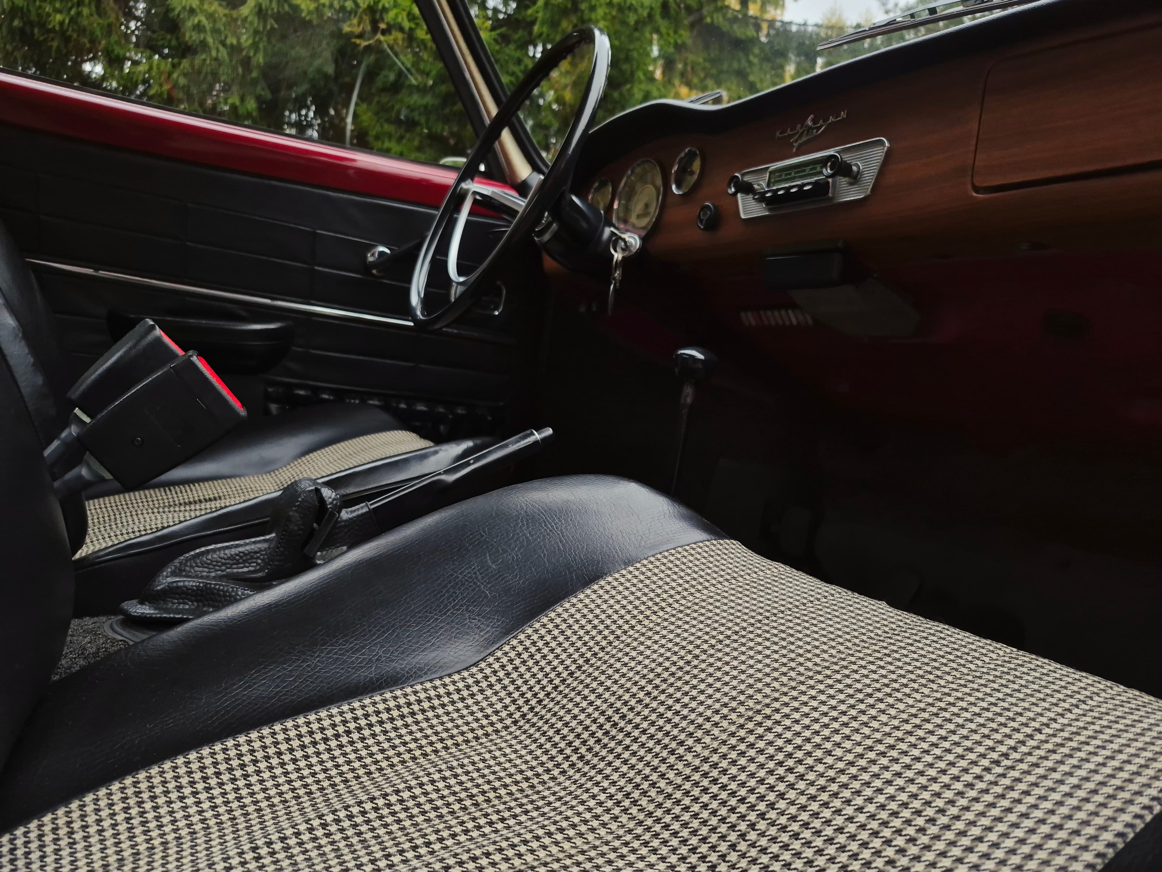 Stunning VW Karmann Ghia Coupe in cherry red with original equipment.