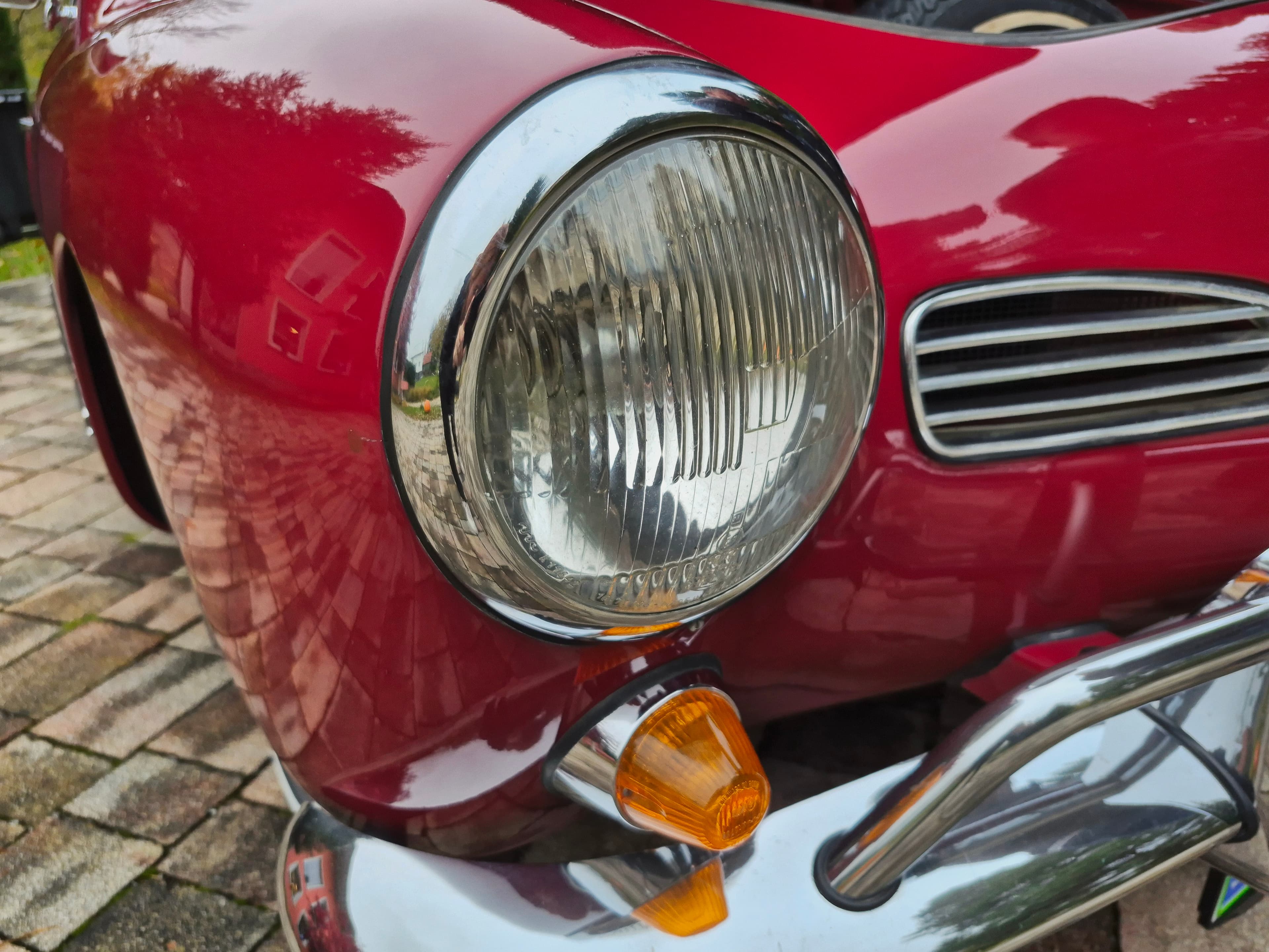 Stunning VW Karmann Ghia Coupe in cherry red with original equipment.