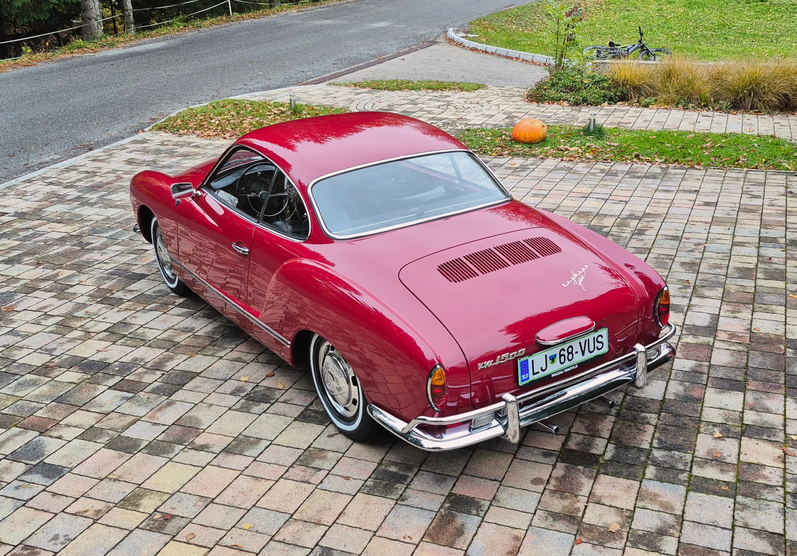 Stunning VW Karmann Ghia Coupe in cherry red with original equipment.