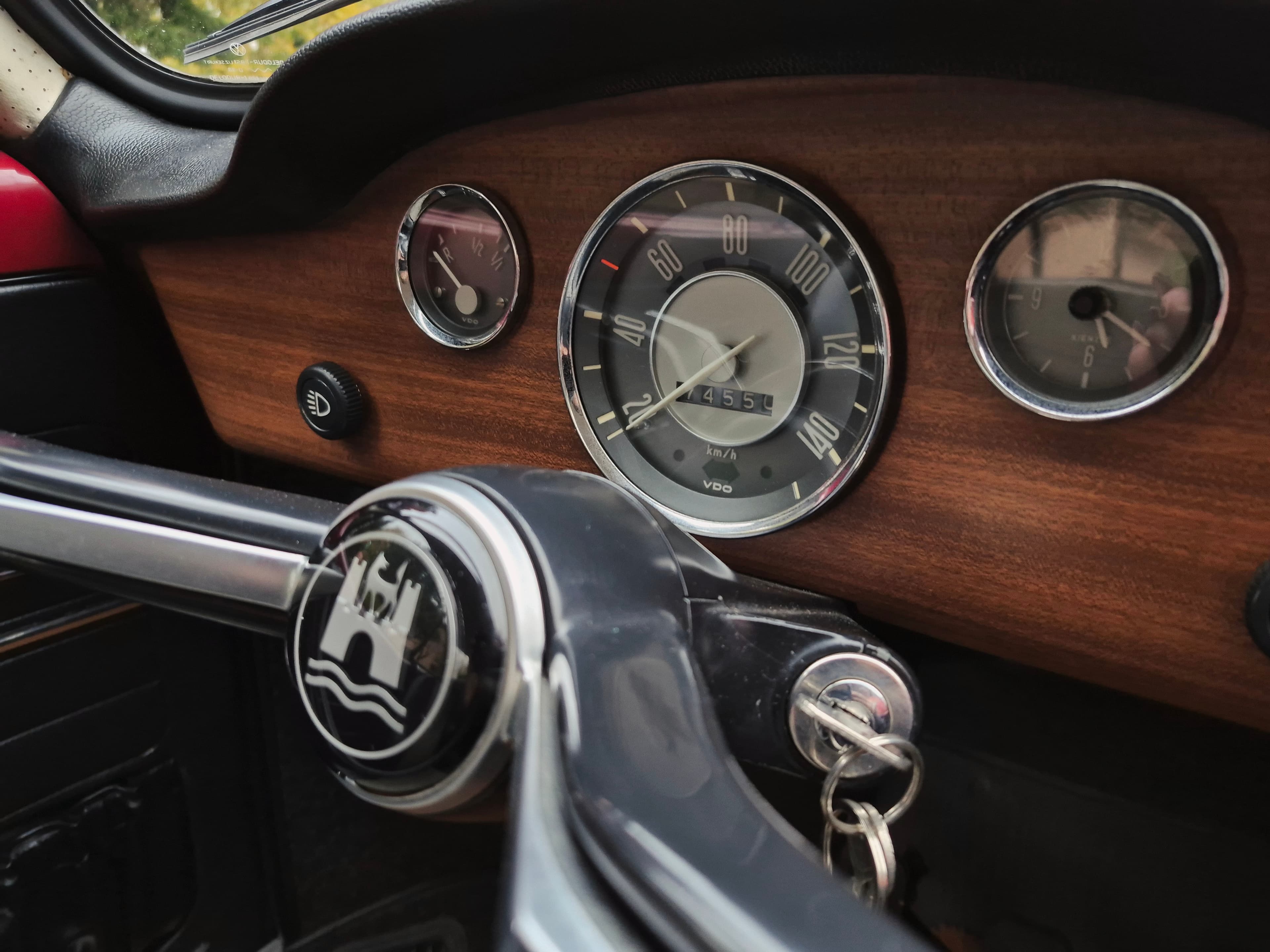Stunning VW Karmann Ghia Coupe in cherry red with original equipment.