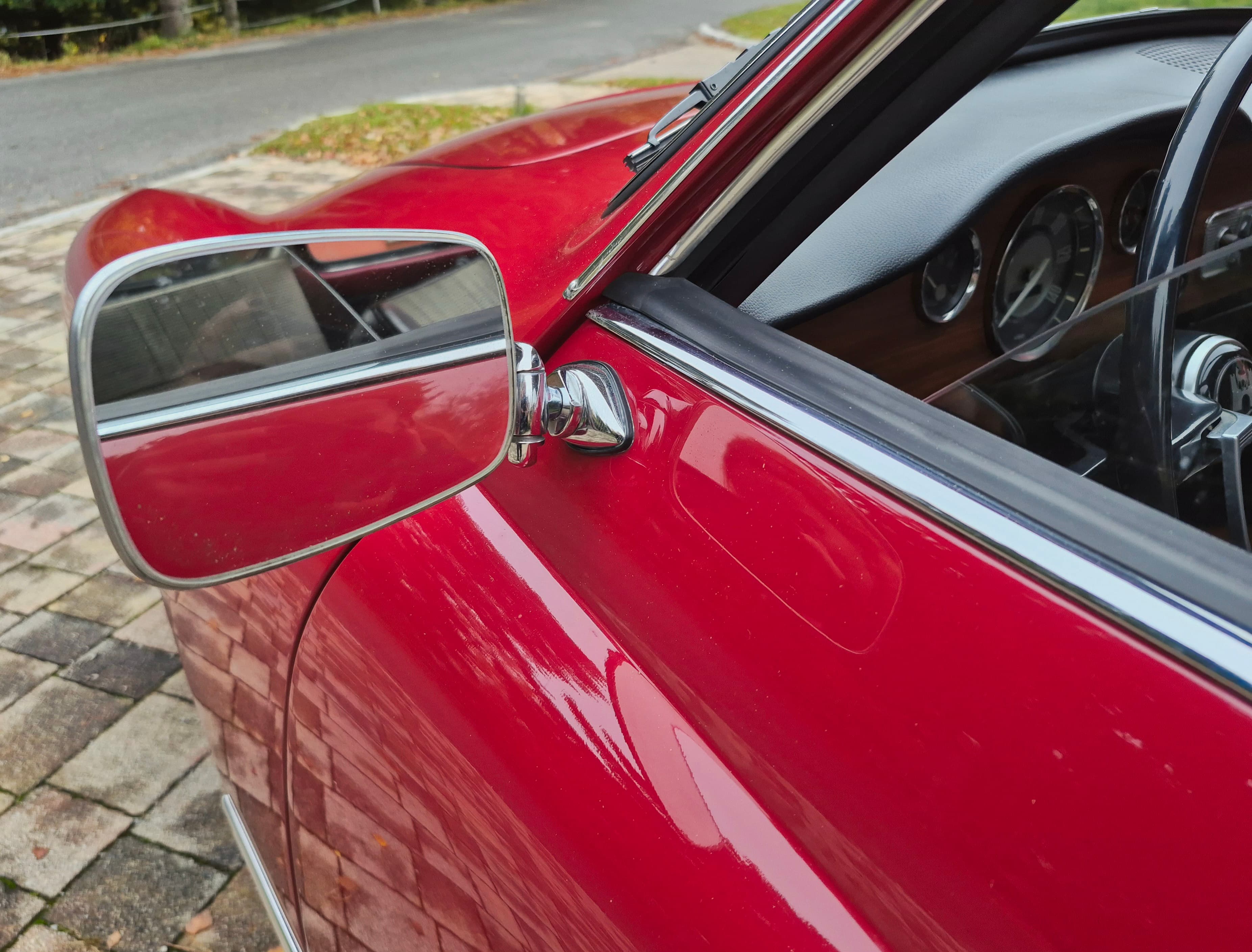 Stunning VW Karmann Ghia Coupe in cherry red with original equipment.