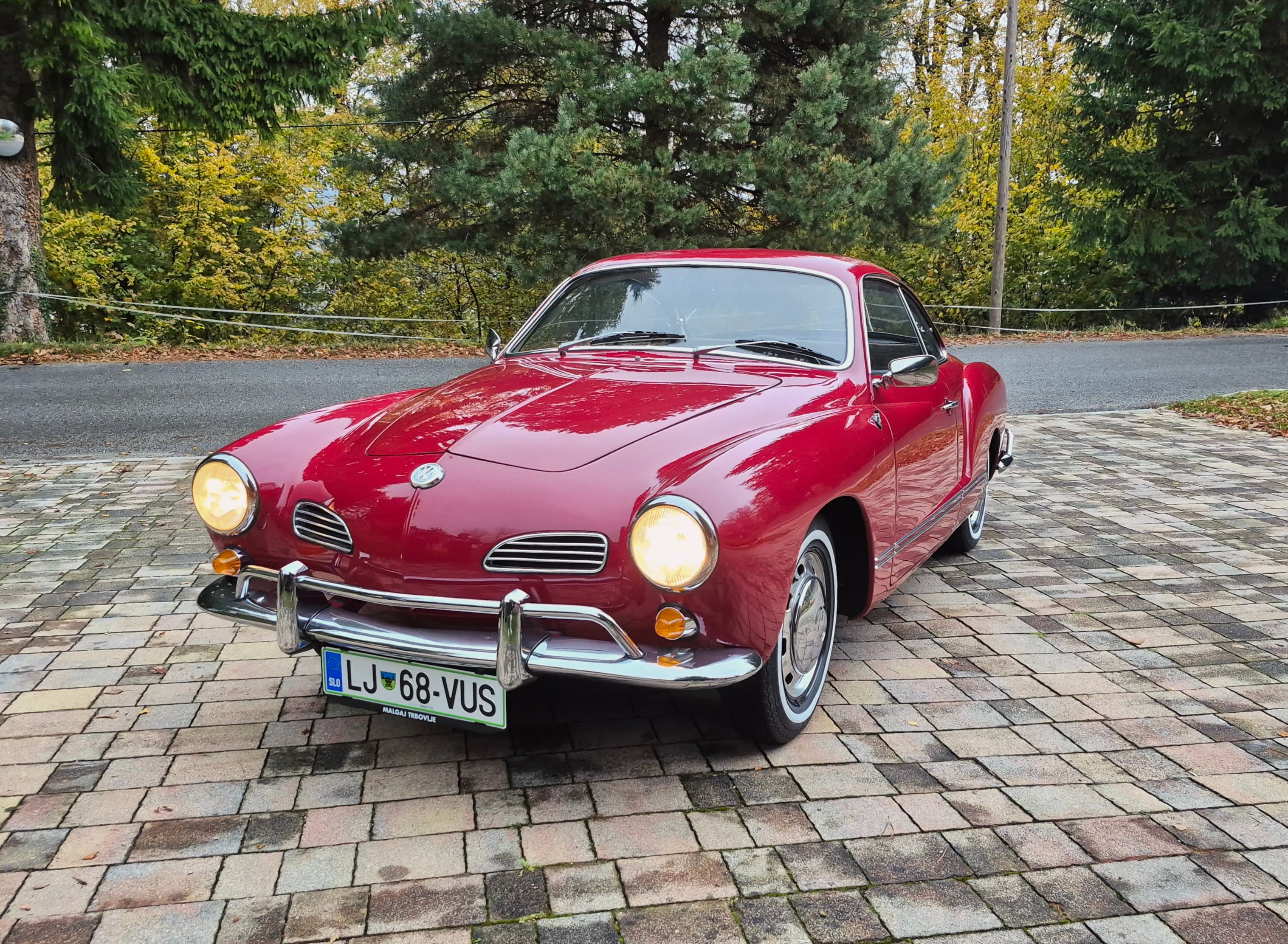 Stunning VW Karmann Ghia Coupe in cherry red with original equipment.
