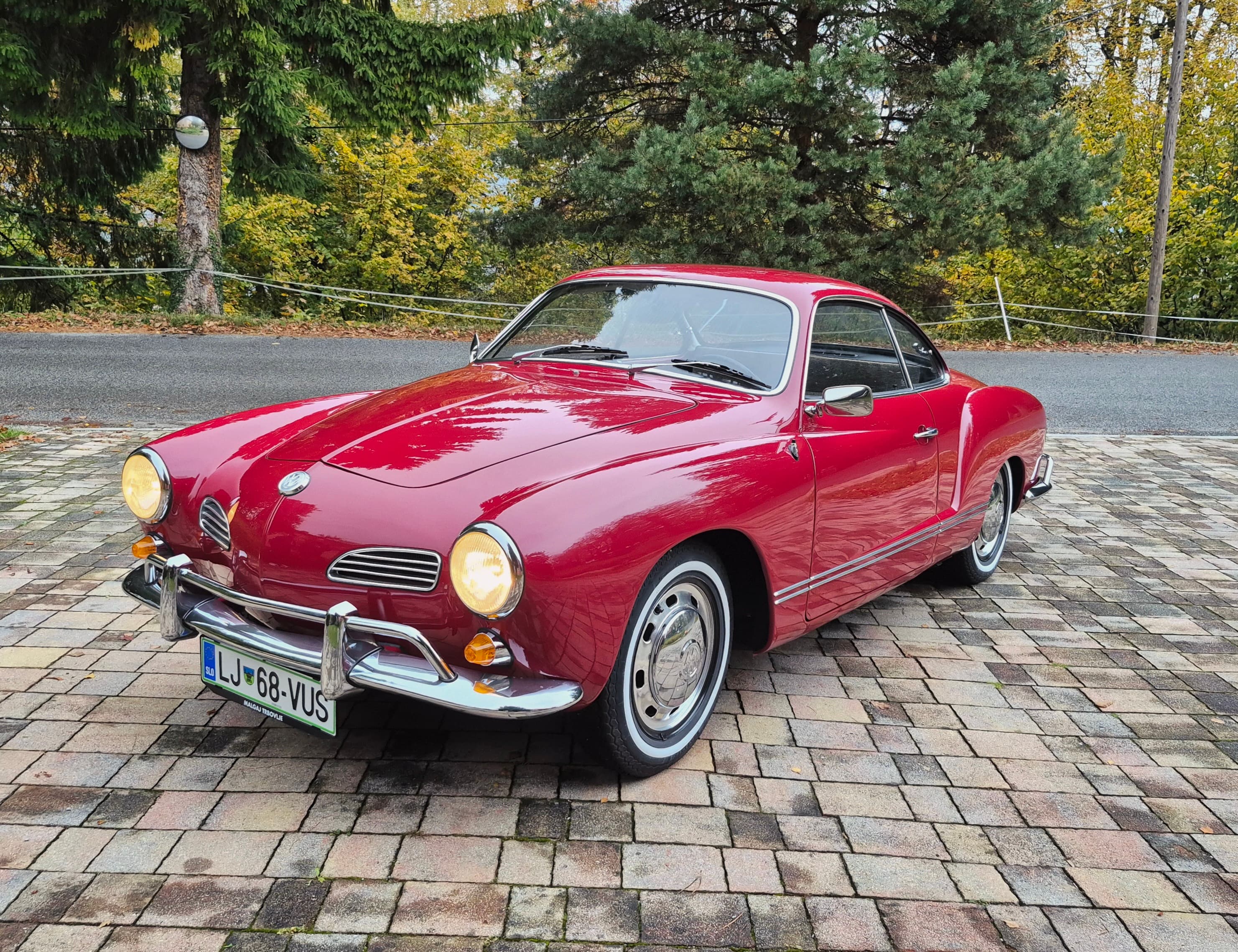 Stunning VW Karmann Ghia Coupe in cherry red with original equipment.