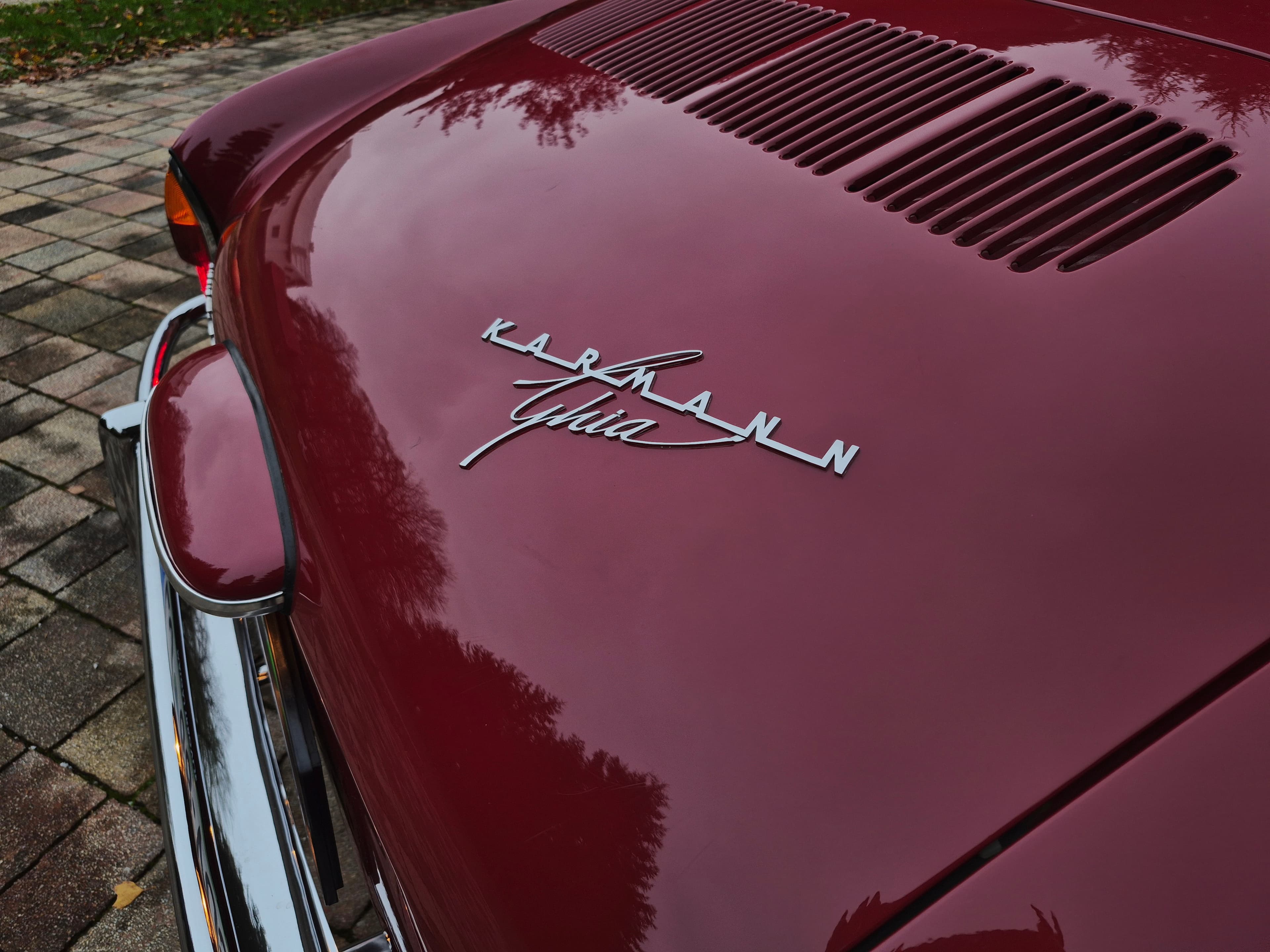 Stunning VW Karmann Ghia Coupe in cherry red with original equipment.