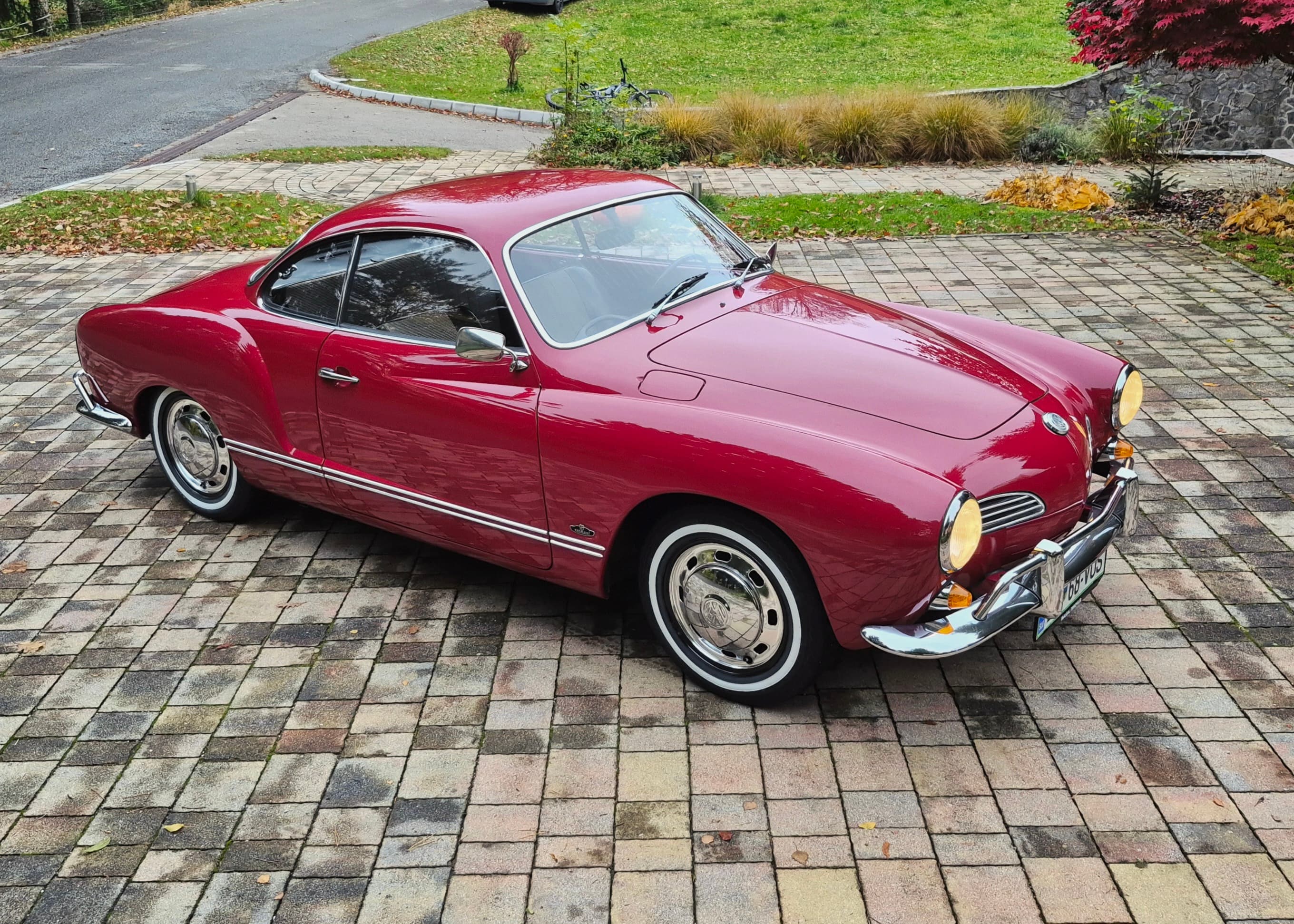 Stunning VW Karmann Ghia Coupe in cherry red with original equipment.